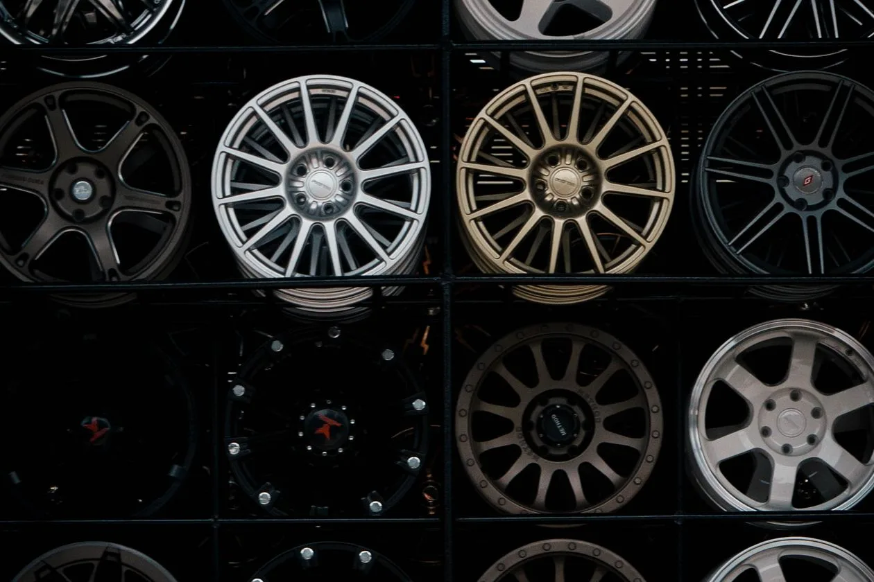 Wall of alloy wheels on display in an automotive accessories shop