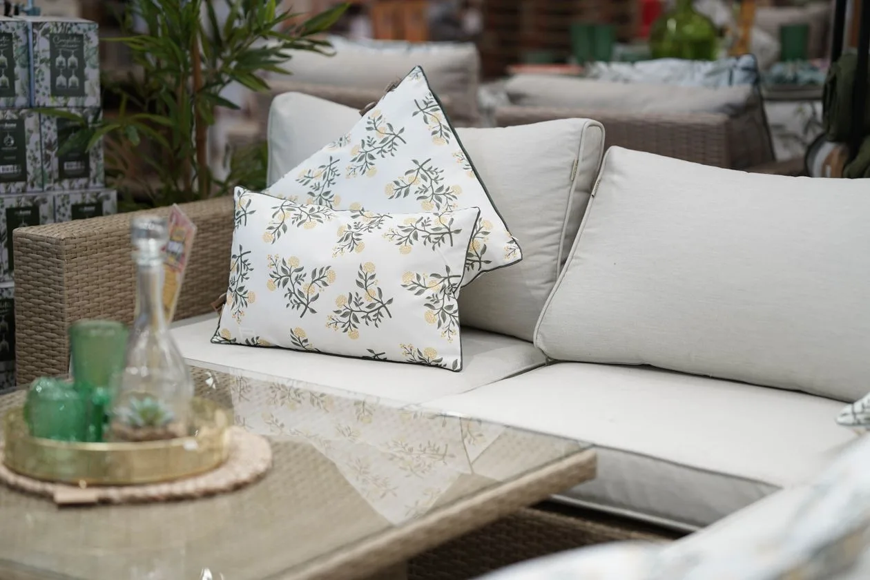 Outdoor living showroom with patio furniture and gas grills