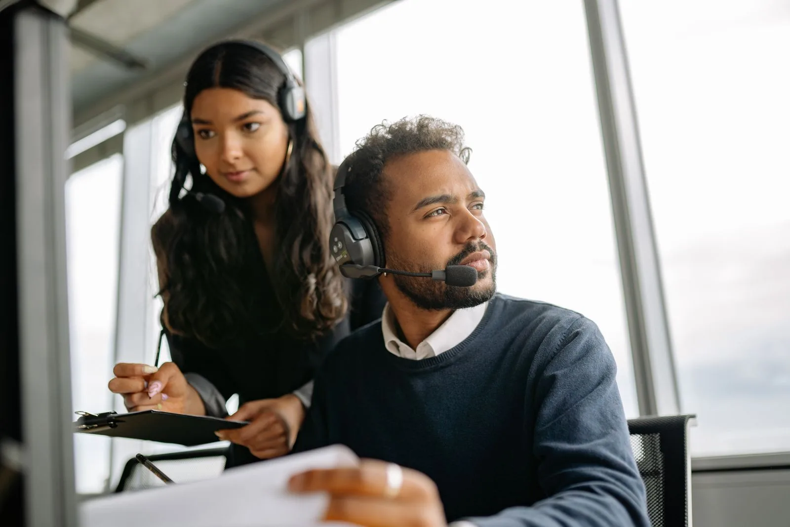 Customer support specialists taking calls at an AMS Retail Solutions help desk