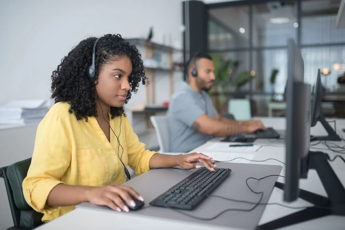 Software support specialists monitoring retail systems